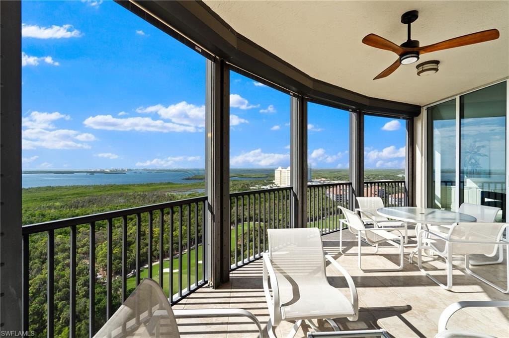 Living area featuring ceiling fan and ornamental molding
