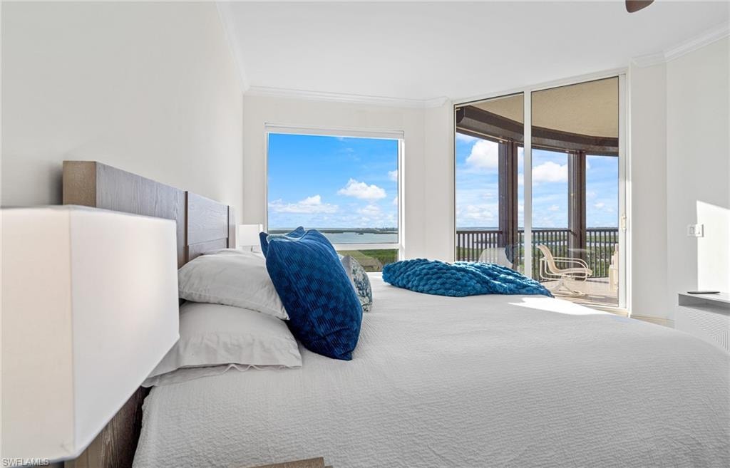Bedroom featuring crown molding and access to outside