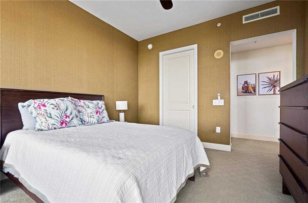 Bedroom featuring light carpet and ceiling fan