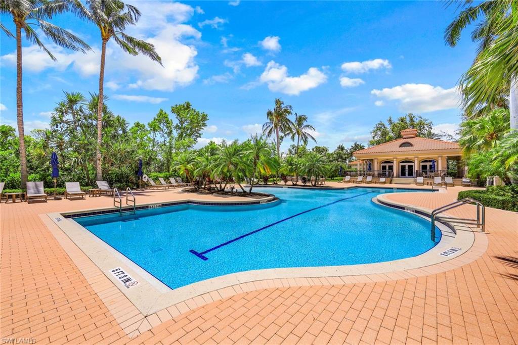 Community pool with a patio