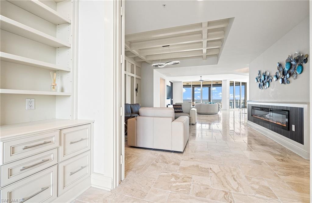 Common area featuring beamed ceiling and coffered ceiling