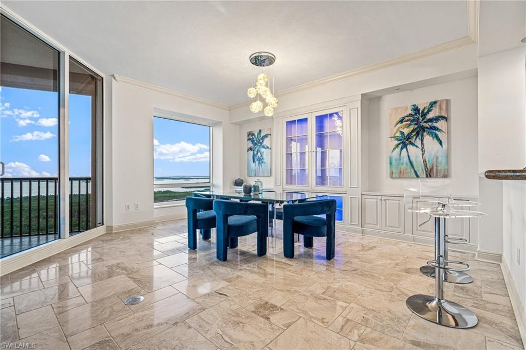 Living area with floor to ceiling windows, ornamental molding, and ceiling fan