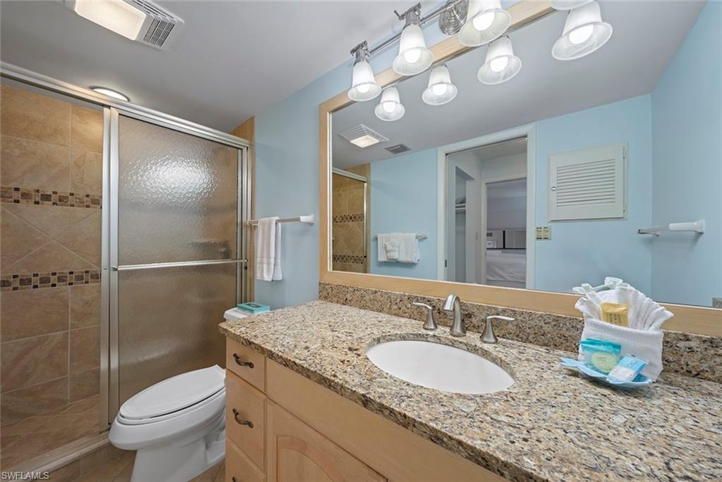Bathroom with vanity and a stall shower