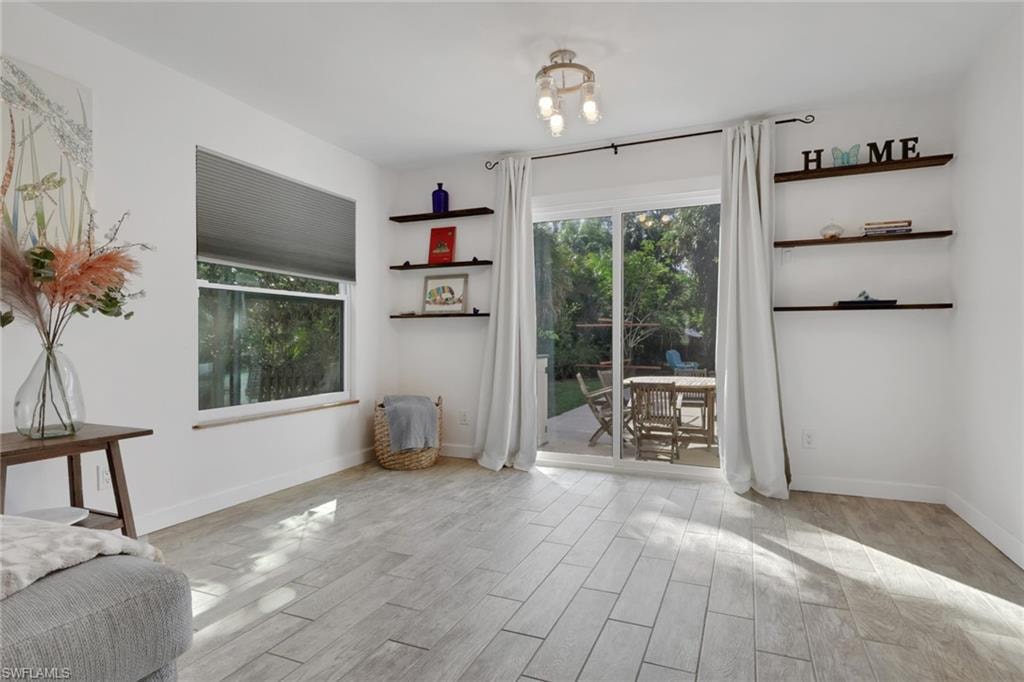 Dining Room off the living room with access to the patio/pool area. Also ideal for entertaining!