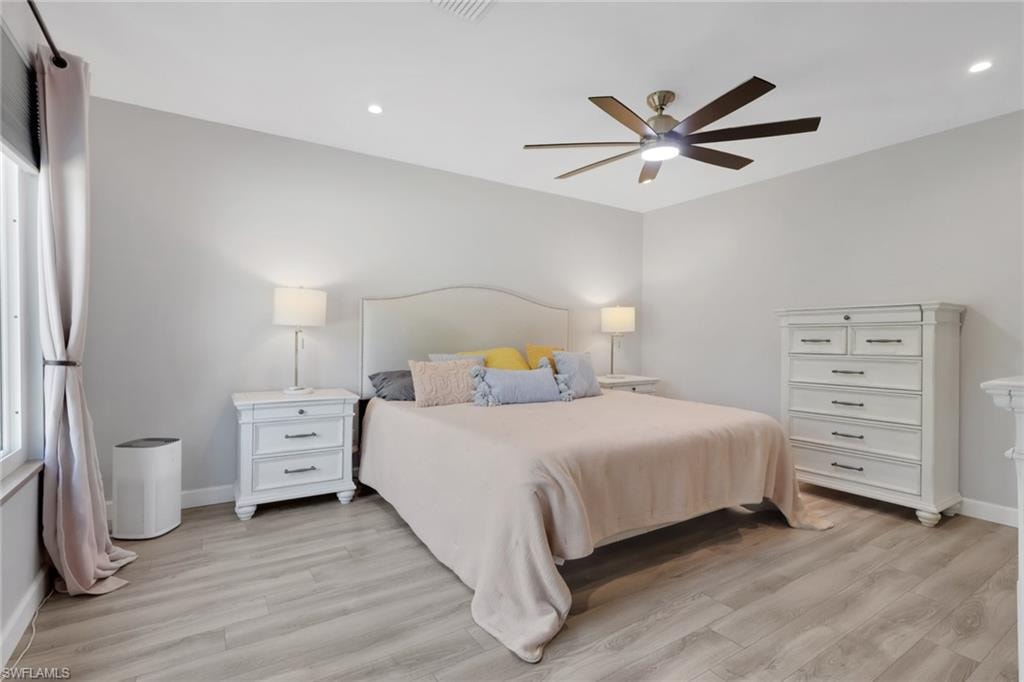 Large master suite with tons of natural lighting and a perfect view of the pool/patio area - your own outdoor oasis
