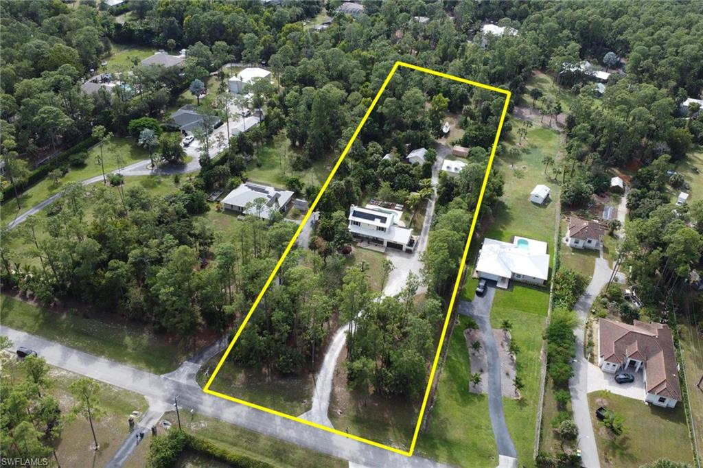 Long driveway with home nicely set back and private guest house and workshop in the rear end with extended driveway that leads you to the back. Completely private.