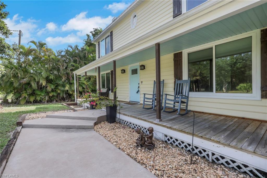 This two-story home greets you with a large wood deck along the front of the home. Sit and enjoy your morning coffee or relax and enjoy the sunset with your favorite beverage