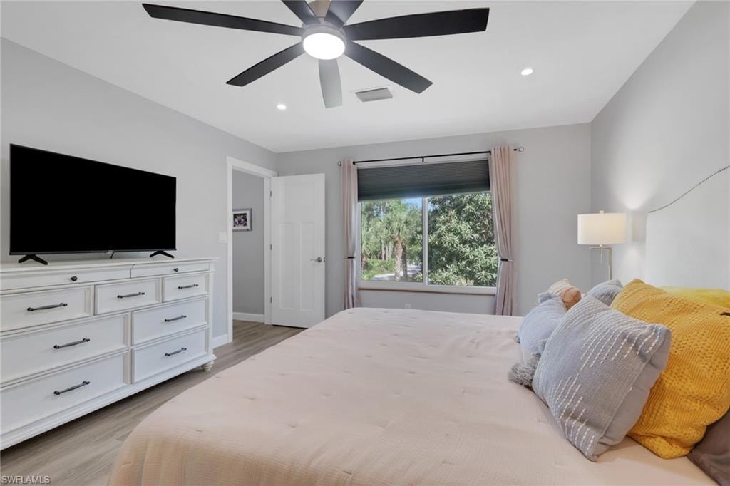 Large master suite with new oversized fan, recess lighting, and a large walk in closet.