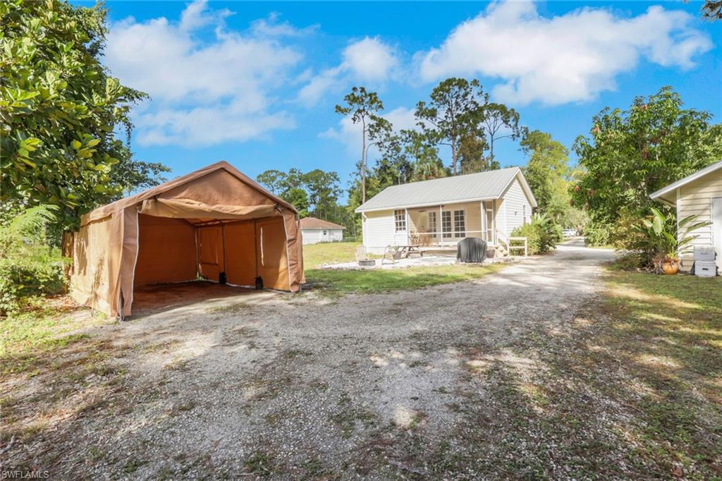 Detached Guest House with Carport and additional parking in the back with it's own private driveway