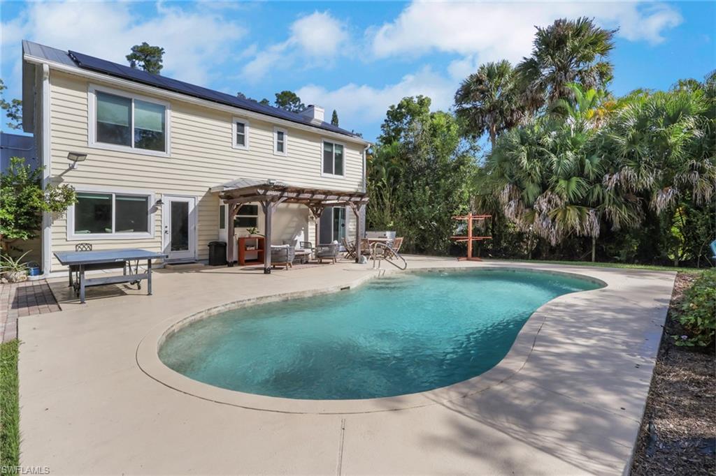 Beautiful saltwater sports pool with a huge patio area with tons of space for seating, relaxing, entertaining, and so much more