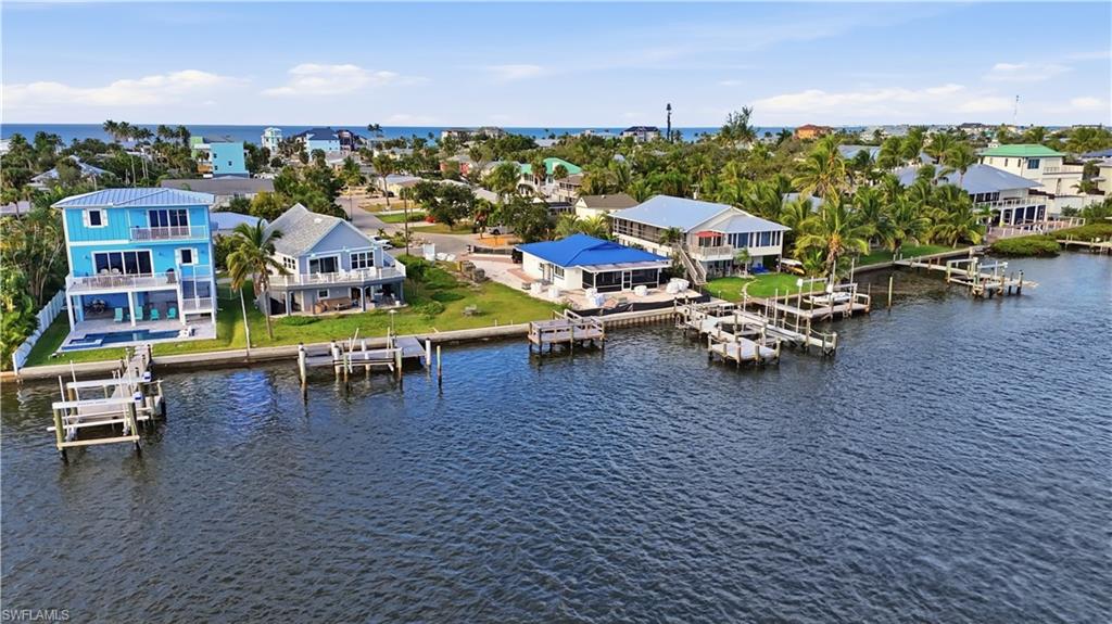 Aerial view of residential area with a nearby body of water - Virtually Edited Image