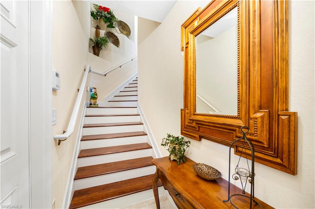 Staircase with tile patterned floors