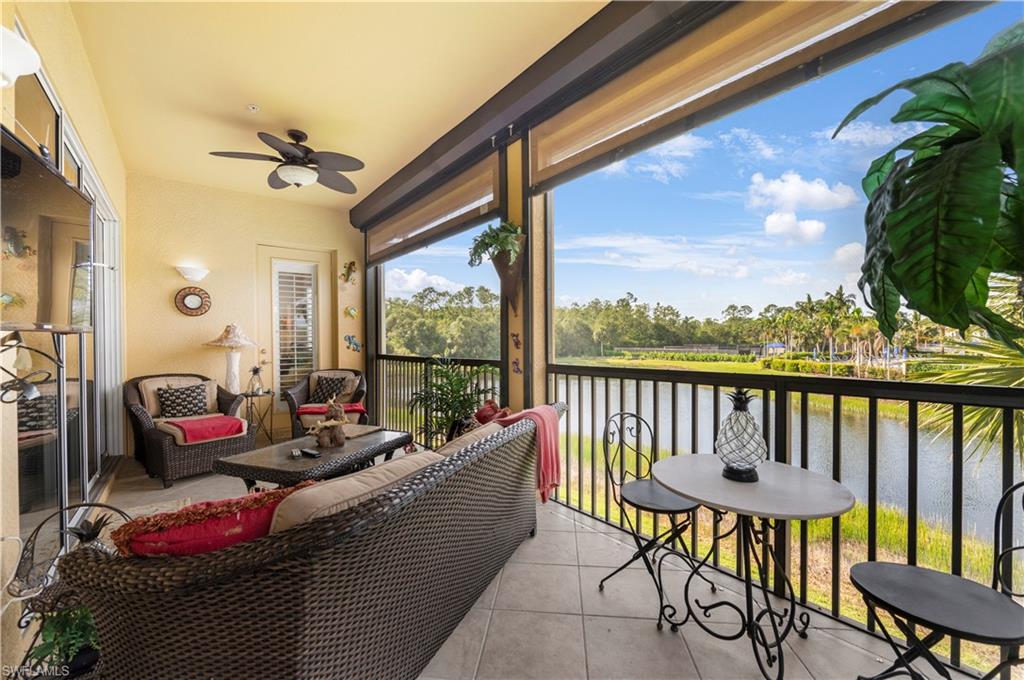 Balcony with a ceiling fan and a water view
