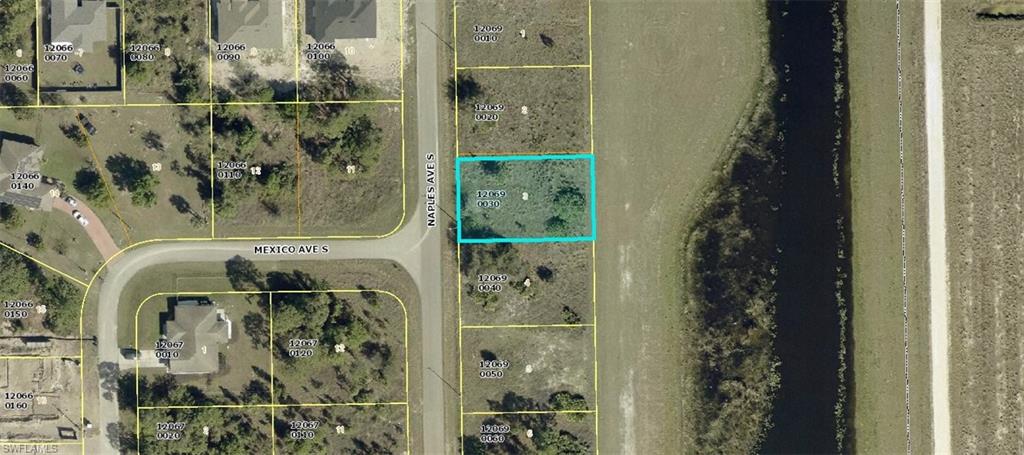 Aerial overview of property's location featuring property parcel outlined