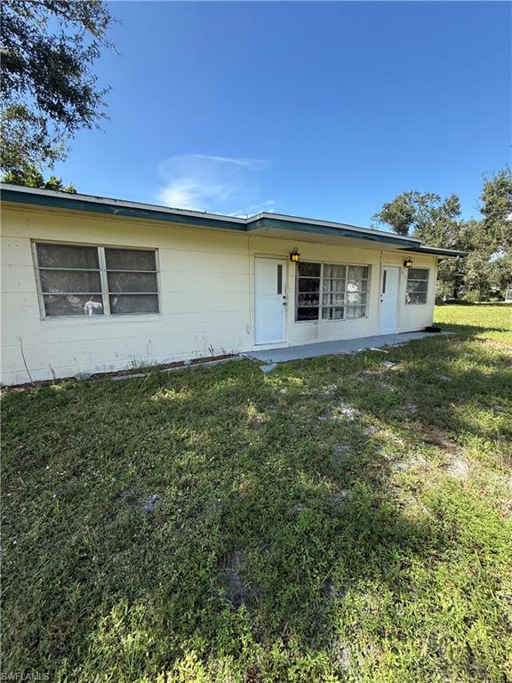 View of front of property with a front yard