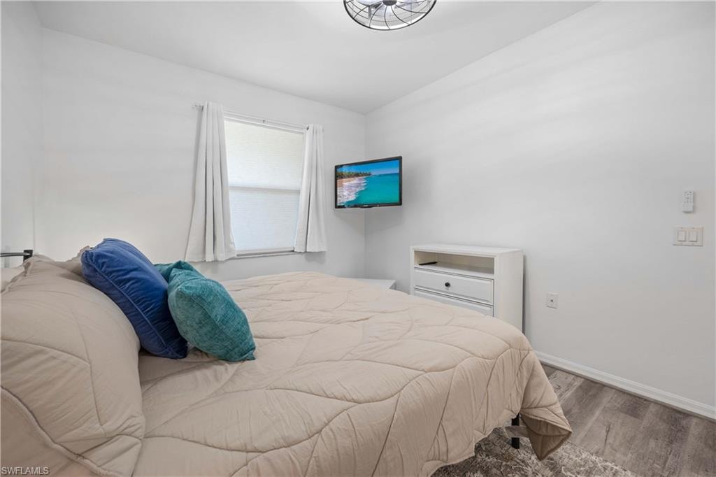 Bedroom featuring wood-type flooring