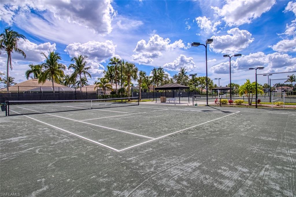 View of tennis court with a gazebo and community basketball court