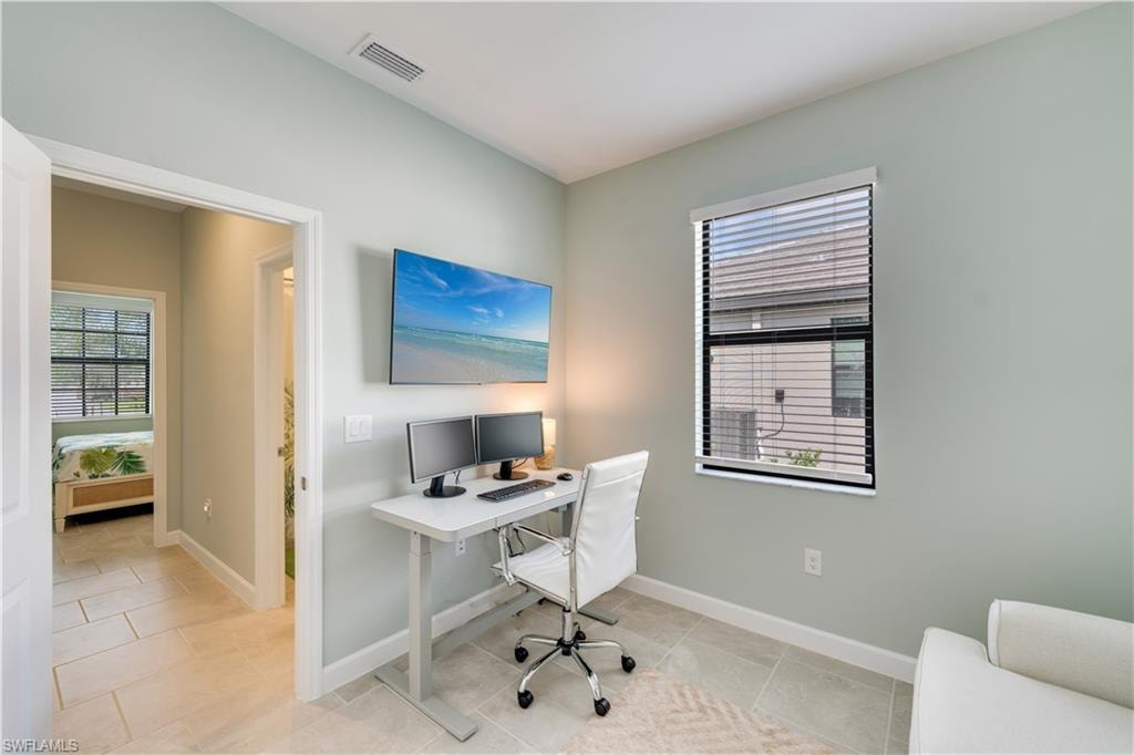 Office area with light tile patterned flooring