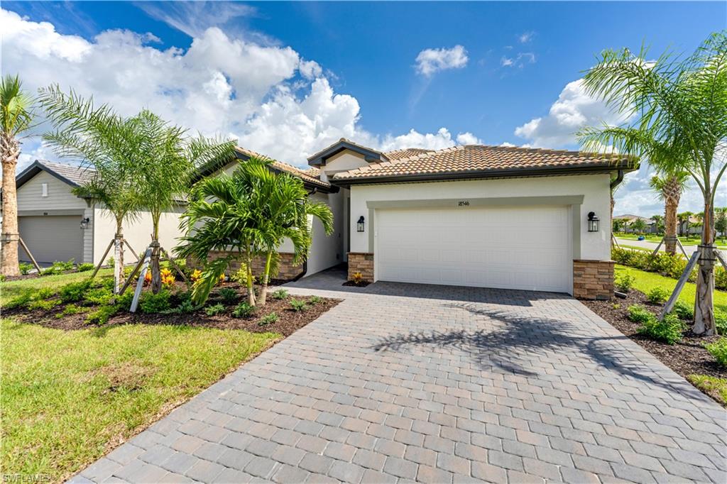 View of front of property with a garage