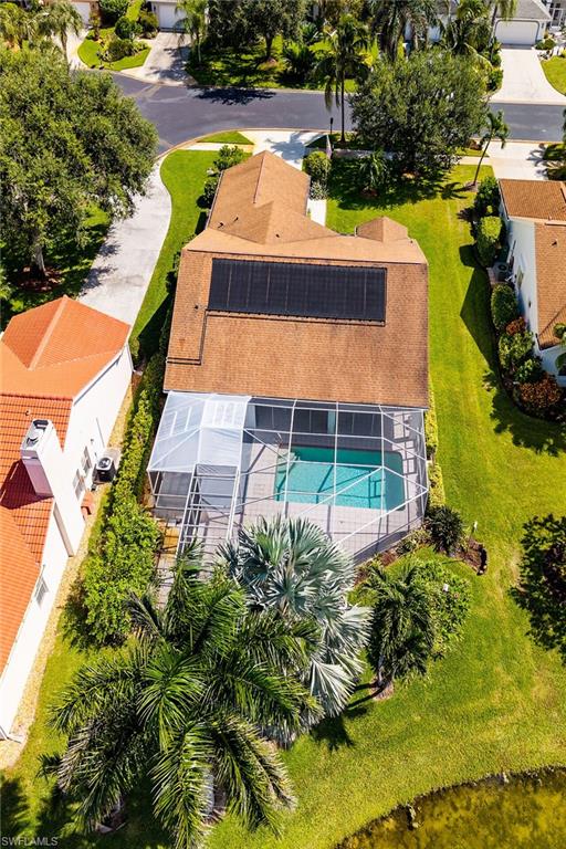 View of subject property featuring a pool