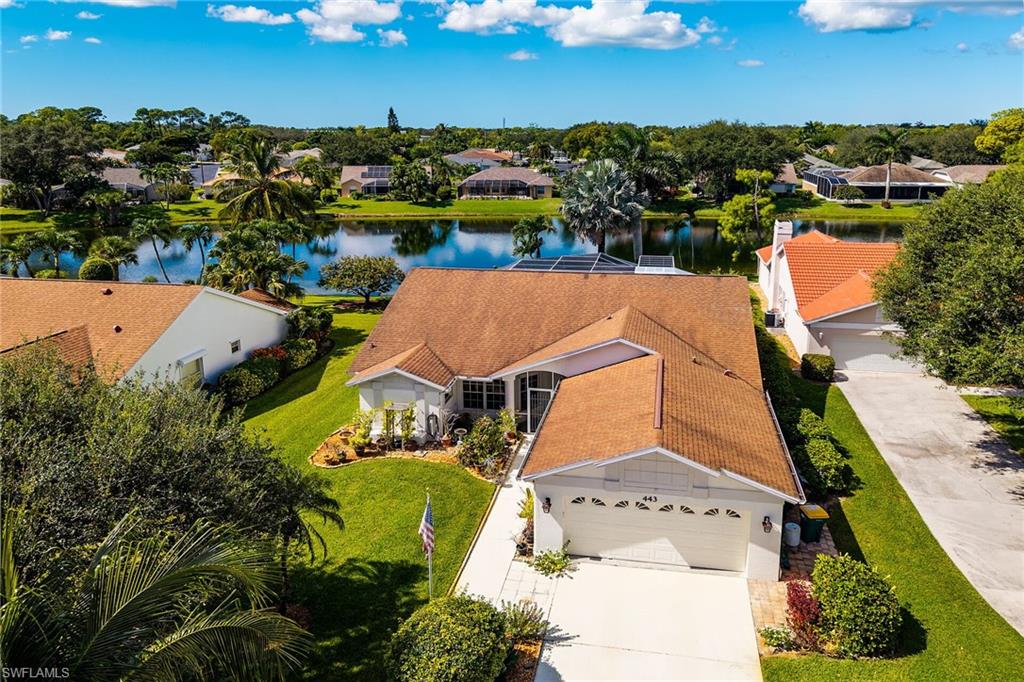 Aerial perspective of suburban area with a nearby body of water
