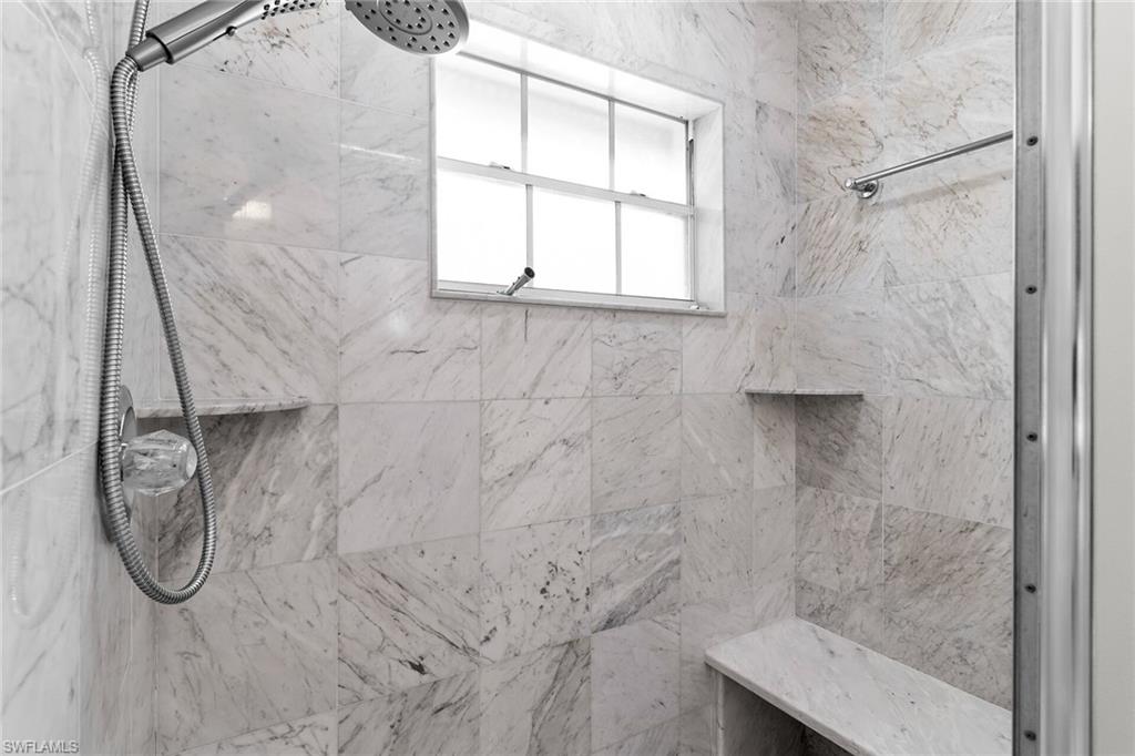 Full bathroom featuring a marble finish shower