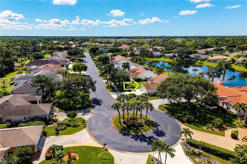 Aerial perspective of suburban area with a nearby body of water