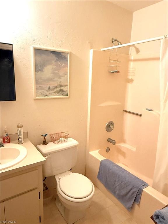 Full bath featuring shower / tub combo, vanity, and tile patterned flooring