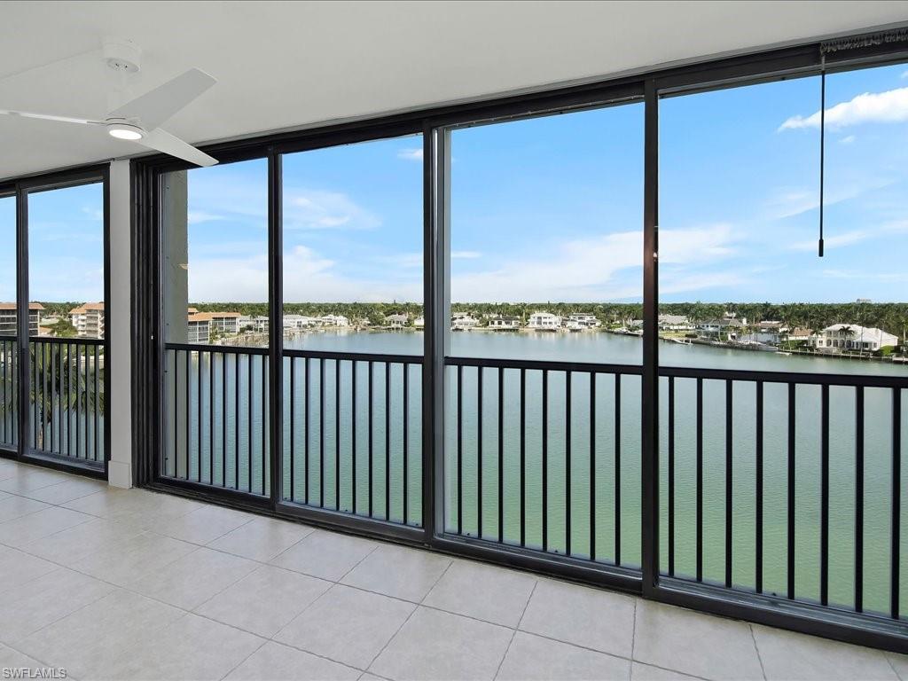 Unfurnished sunroom with a water view