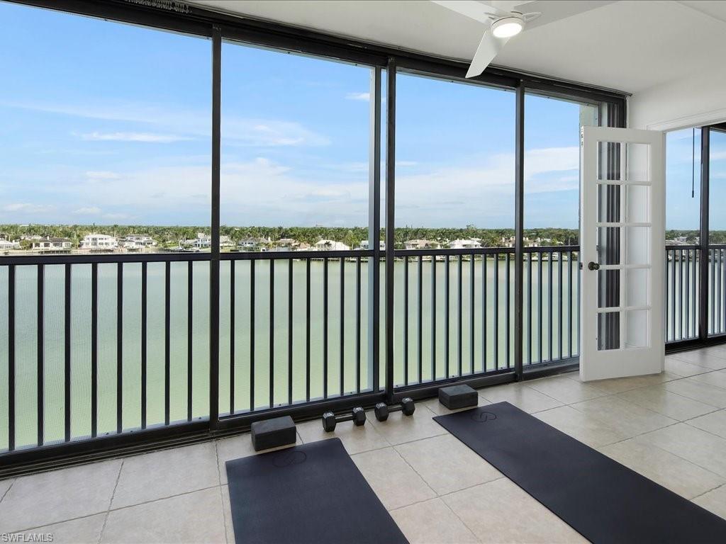 Unfurnished sunroom with a water view