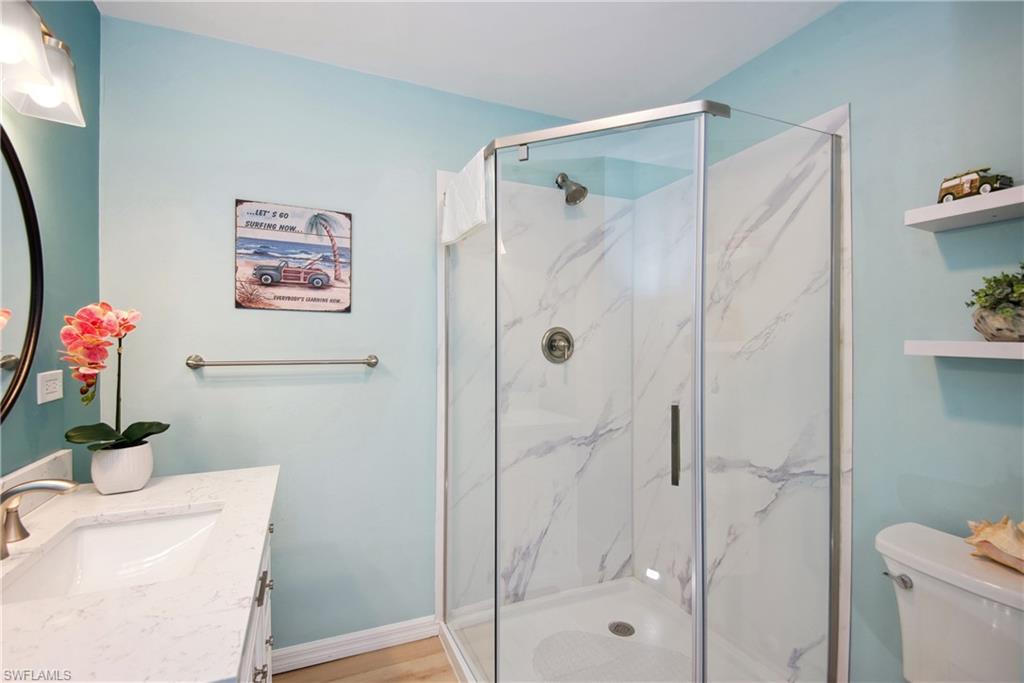 Full bath with vanity and a marble finish shower - Virtually Edited Image