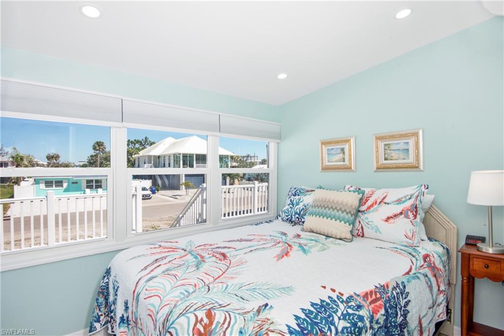 Bedroom with recessed lighting and lofted ceiling - Virtually Edited Image