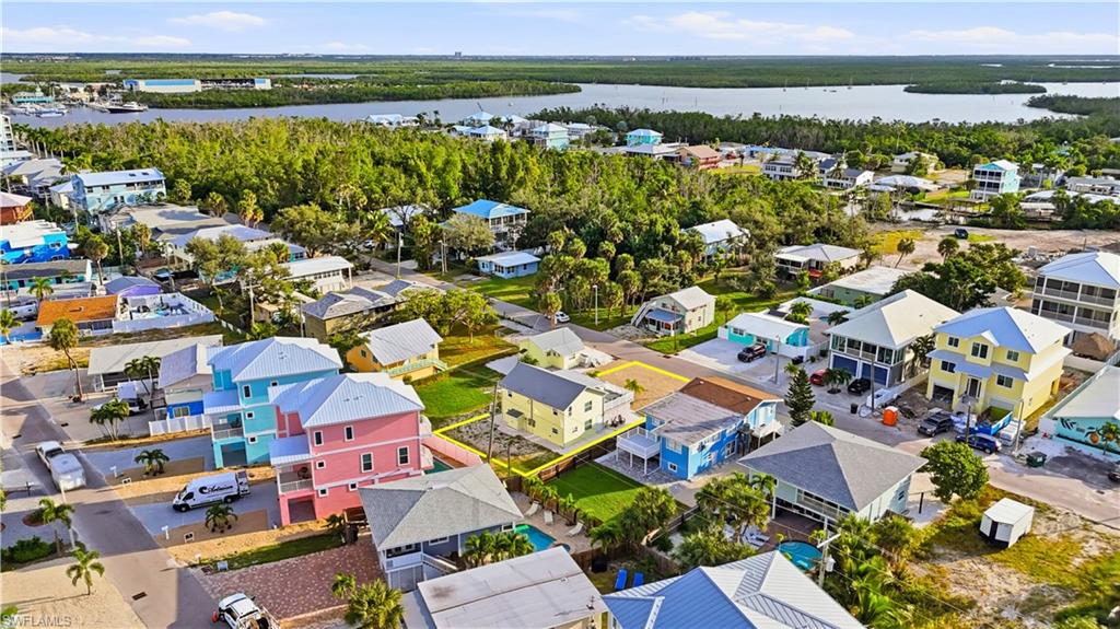 Aerial view of residential area with a large body of water - Virtually Edited Image