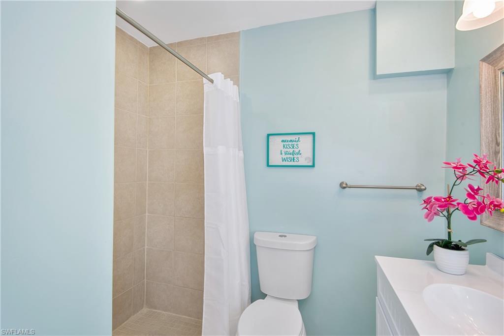 Bathroom with a stall shower and vanity - Virtually Edited Image