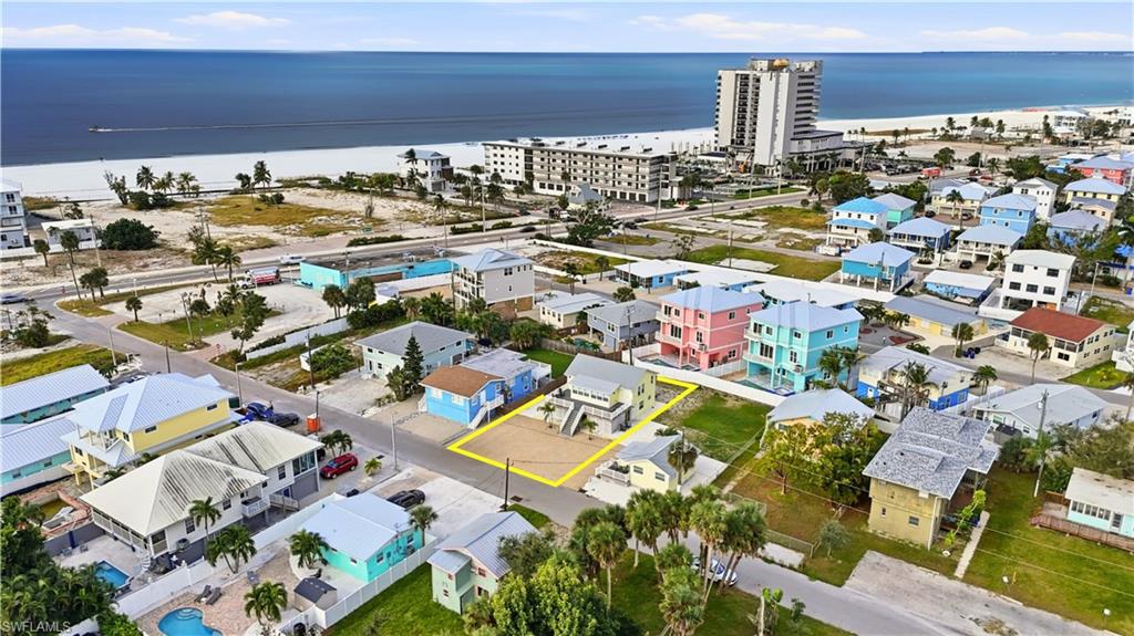 View of property location featuring a nearby body of water and property boundaries highlighted - Virtually Edited Image