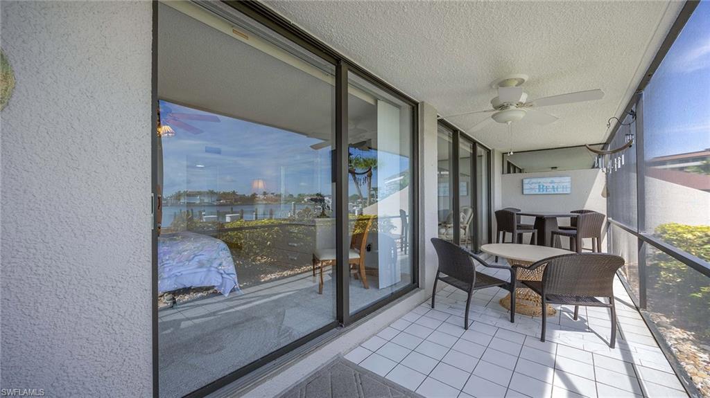 Sunroom with a ceiling fan