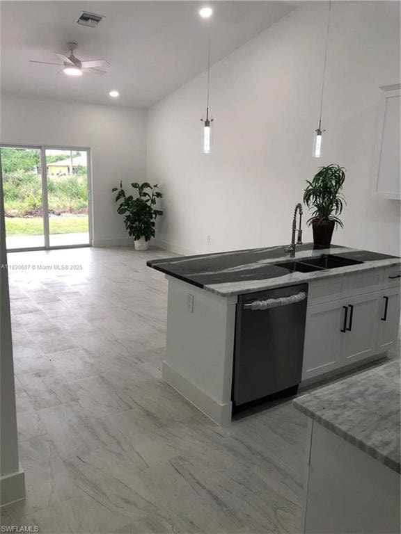 Kitchen with decorative light fixtures, dishwasher, open floor plan, white cabinets, and recessed lighting