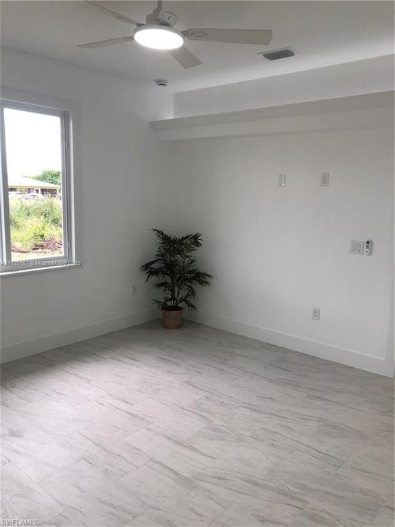 Unfurnished room with ceiling fan and light wood-style floors
