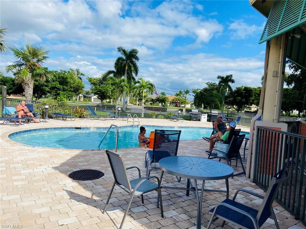 Community pool featuring a patio