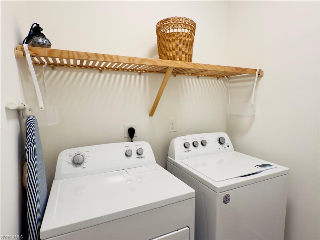 Laundry area with washing machine and clothes dryer