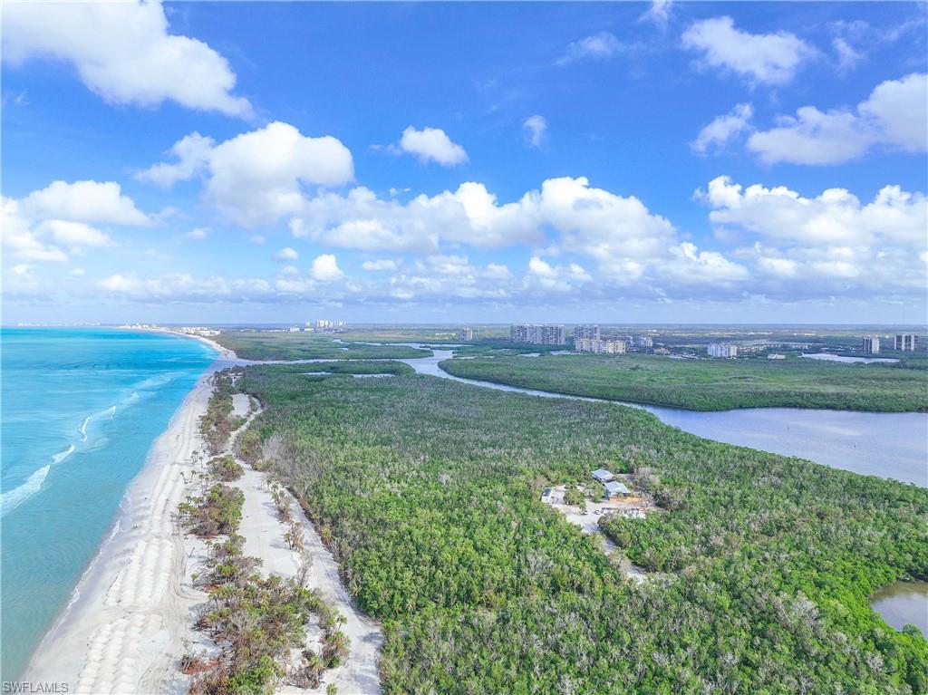 Drone / aerial view featuring a water view and a beach view