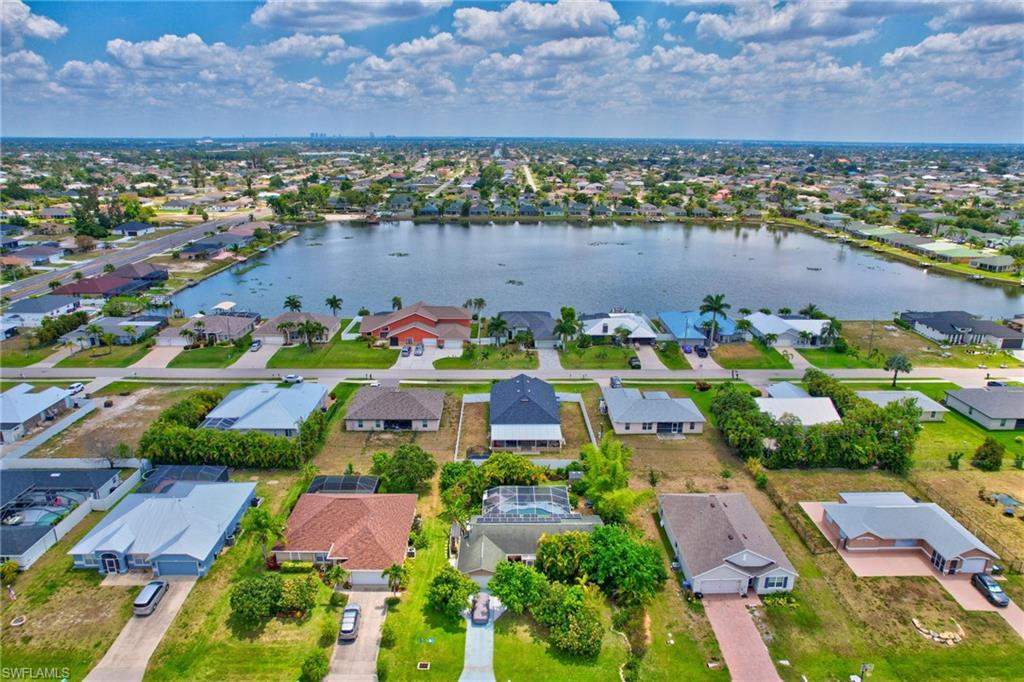 Aerial perspective of suburban area with a large body of water