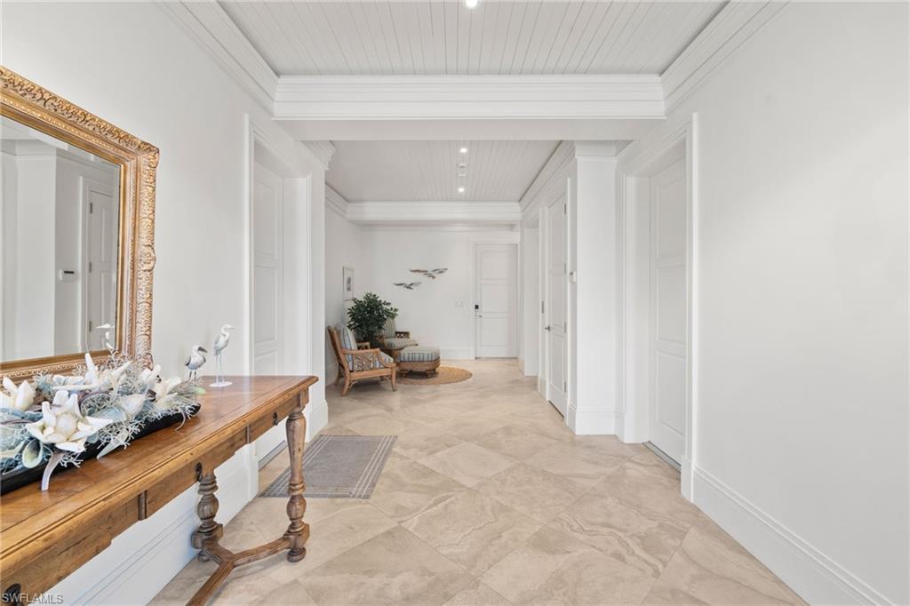 Hall featuring crown molding and recessed lighting