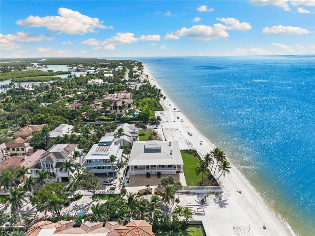 Drone / aerial view of waterfront with a beach
