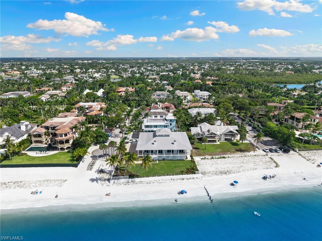 Aerial perspective of suburban area featuring unending shoreline