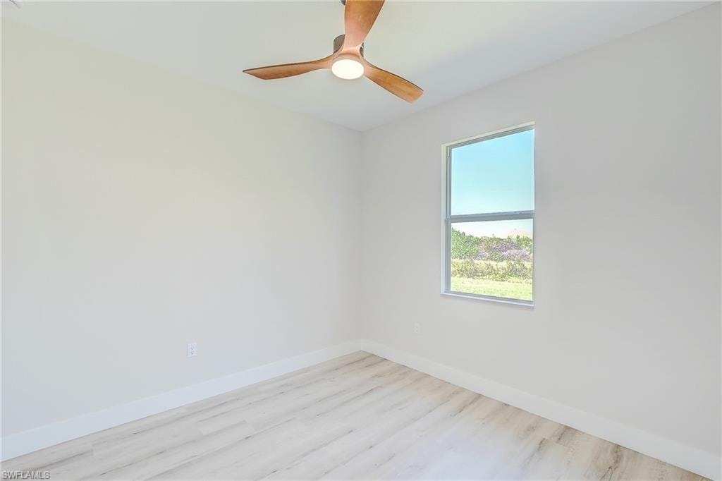 Bedroom featuring ceiling fan and wood finished floors