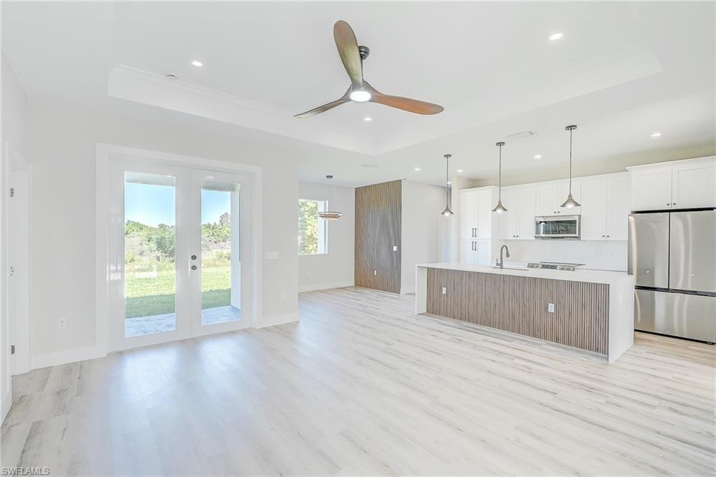 Dining space featuring light wood-type flooring and a chandelier
