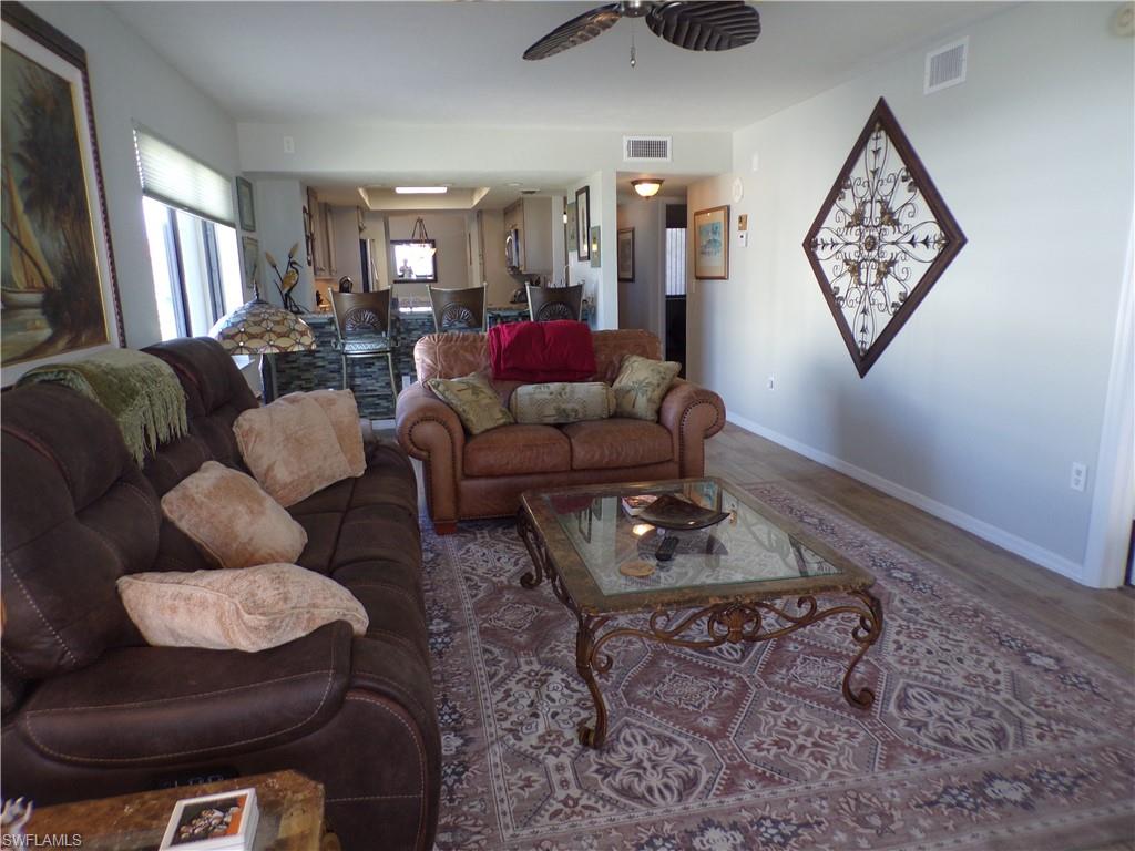 Dining room featuring wood finished floors and baseboards