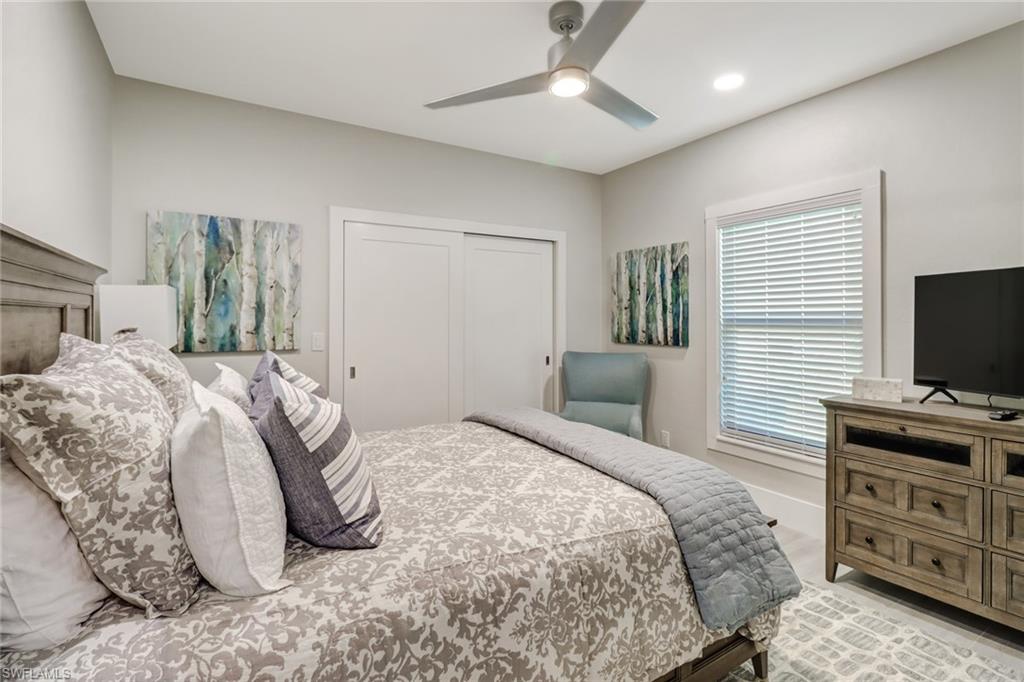 Bedroom featuring a ceiling fan, a closet, recessed lighting, and light wood finished floors