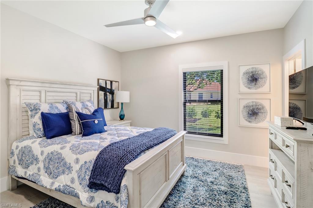 Bedroom featuring a ceiling fan and light wood-style floors